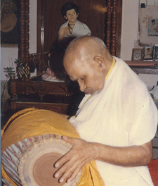 Dr. Mahanambrata Brahmachari playing Mridanga ( musical instrument )